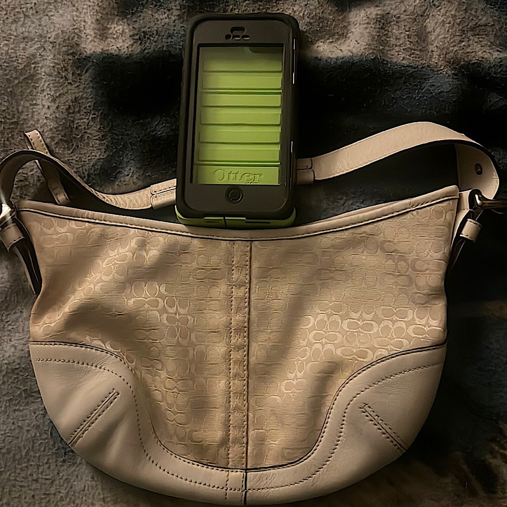 It’s a coach brand handbag and an otterbox iPhone 5 case,